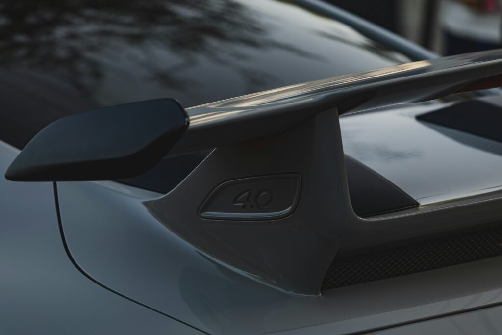 a close up of a car with a surfboard on the roof